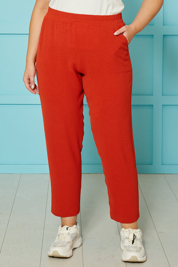 TROUSERS WITH FLOWING FABRIC