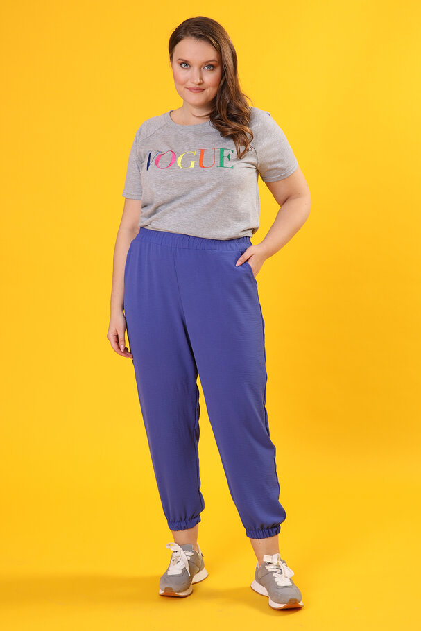 TROUSERS WITH FLOWING FABRIC
