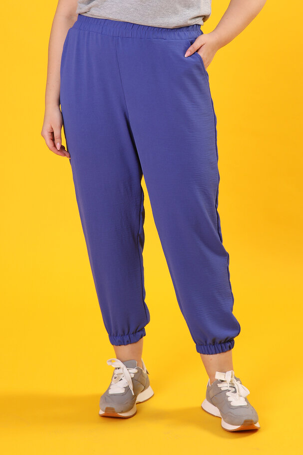 TROUSERS WITH FLOWING FABRIC