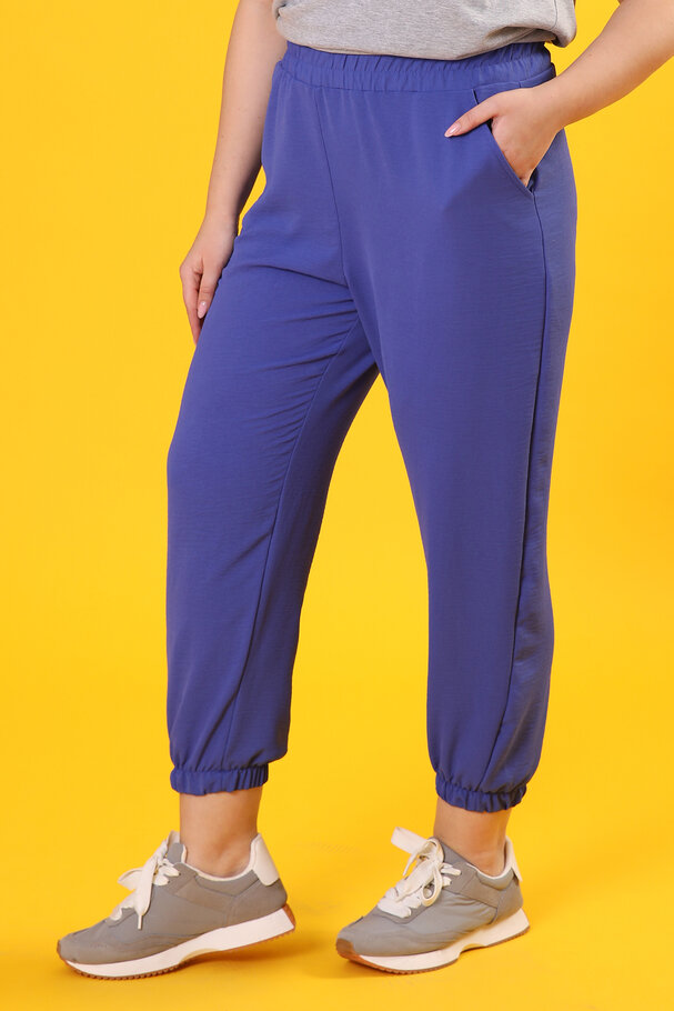 TROUSERS WITH FLOWING FABRIC