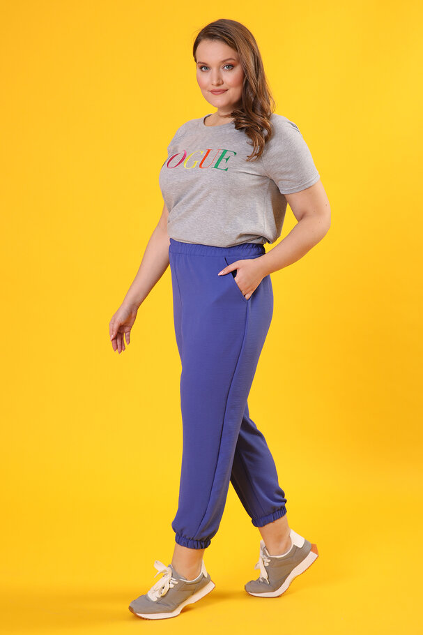 TROUSERS WITH FLOWING FABRIC