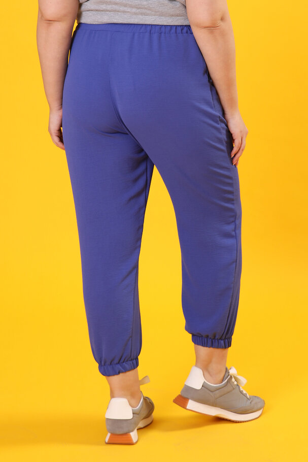 TROUSERS WITH FLOWING FABRIC