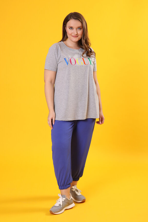 TROUSERS WITH FLOWING FABRIC