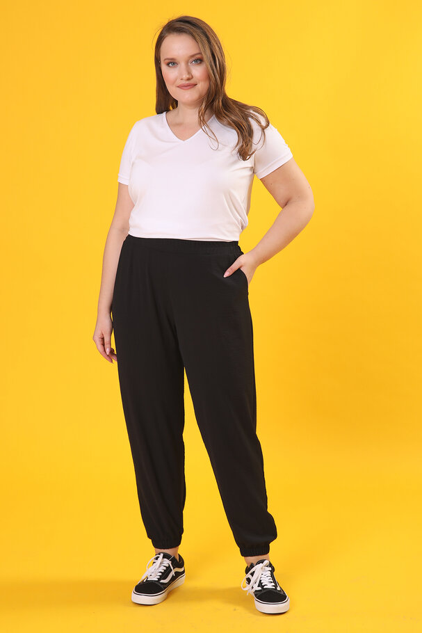 TROUSERS WITH FLOWING FABRIC