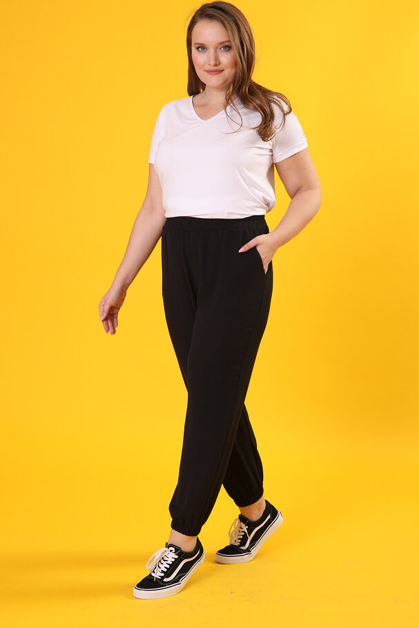 TROUSERS WITH FLOWING FABRIC