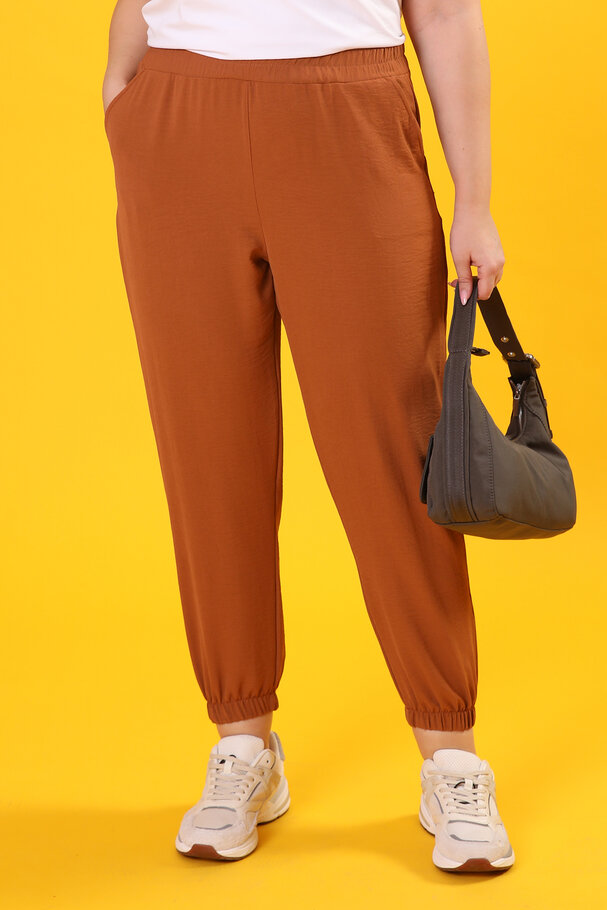 TROUSERS WITH FLOWING FABRIC