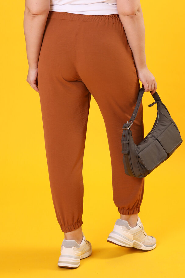 TROUSERS WITH FLOWING FABRIC