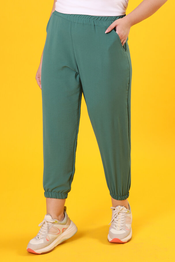 TROUSERS WITH FLOWING FABRIC