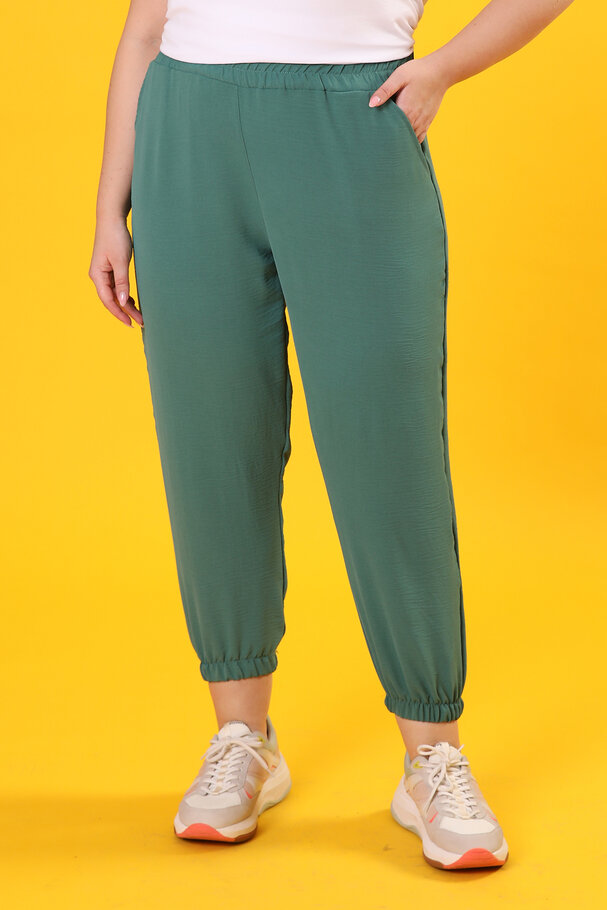 TROUSERS WITH FLOWING FABRIC