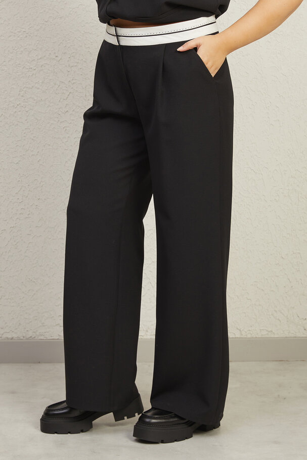 TROUSERS WITH TURN-UP WAIST